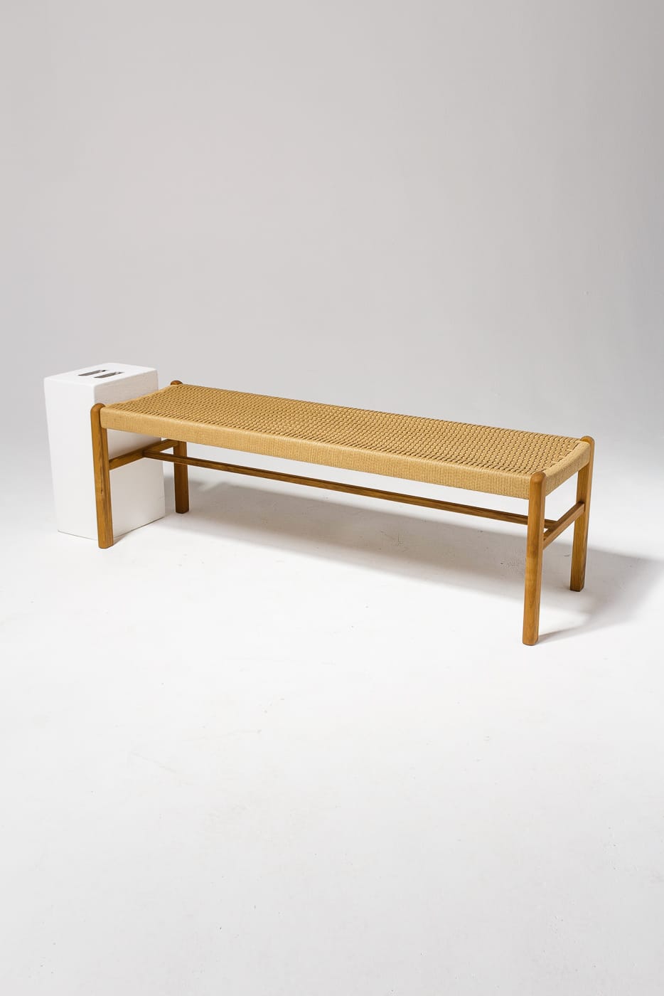 AB057 Chester Woven Rattan Bench Prop Rental | ACME Brooklyn