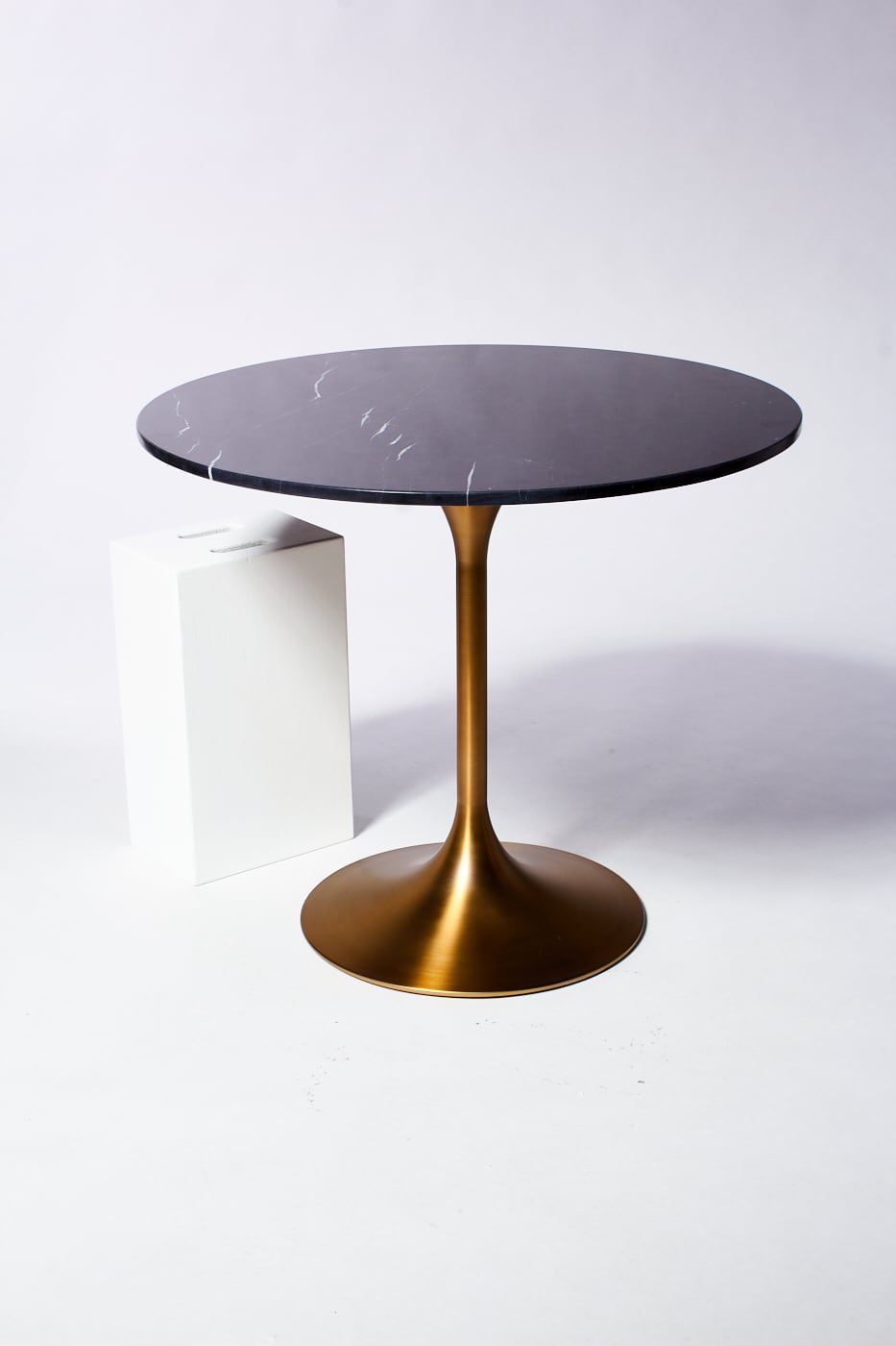 TB232 Midnight Black Marble Tulip Dining Table Prop Rental | ACME Brooklyn